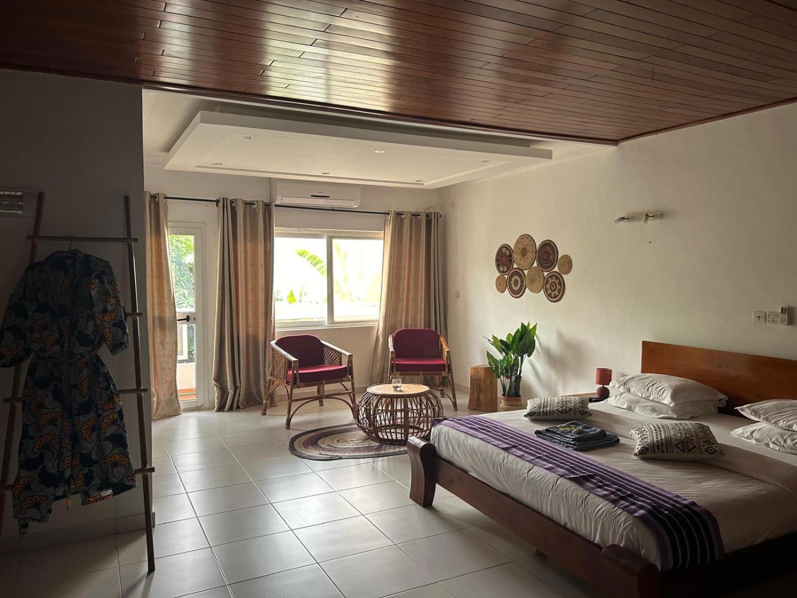 L'Oasis Guesthouse Cotonou Exterior foto